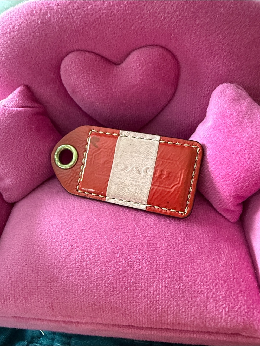 Coach Coral and Pink Leather Hang Tag. Good condition. Minor Marks.